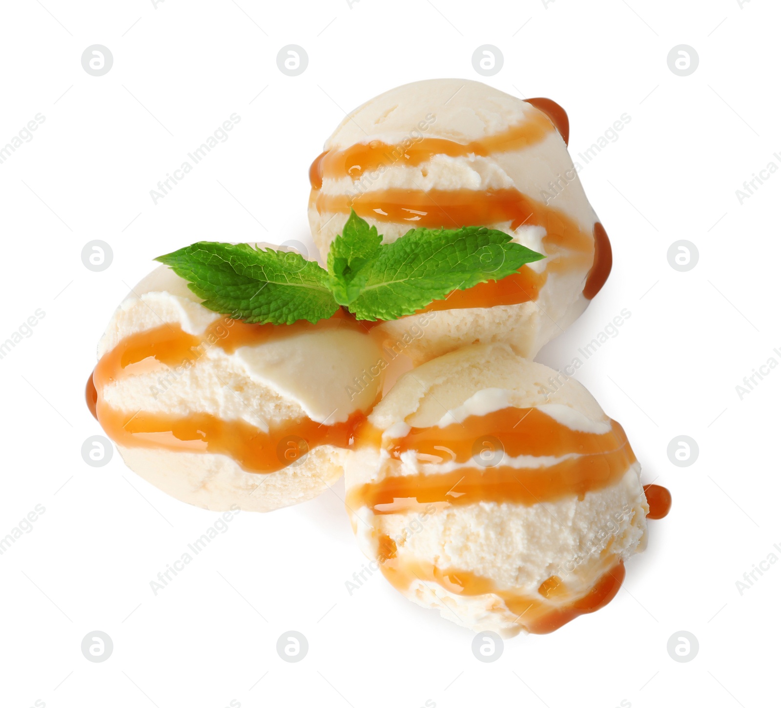 Photo of Scoops of delicious ice cream with mint and caramel sauce on white background, top view