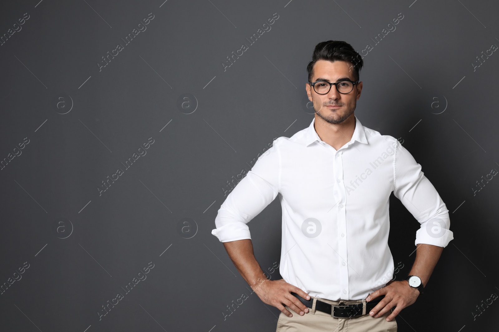 Photo of Portrait of handsome young man and space for text on black background