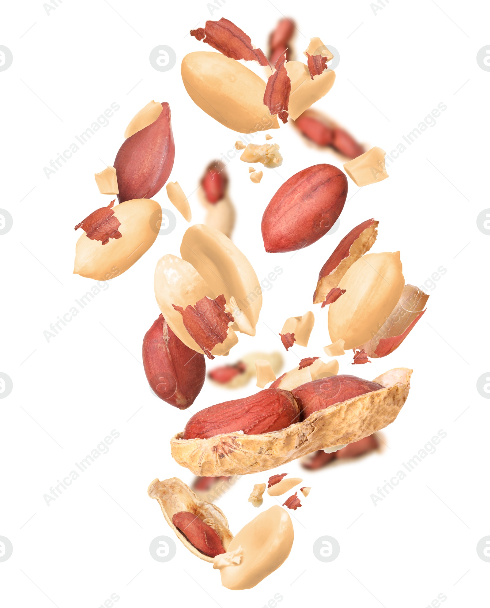 Image of Unpeeled peanuts in air on white background