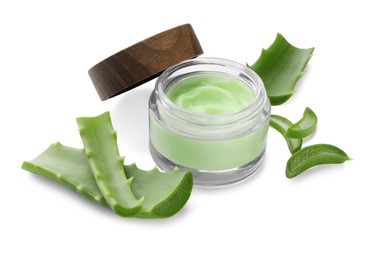 Jar of natural cream and cut aloe leaves isolated on white