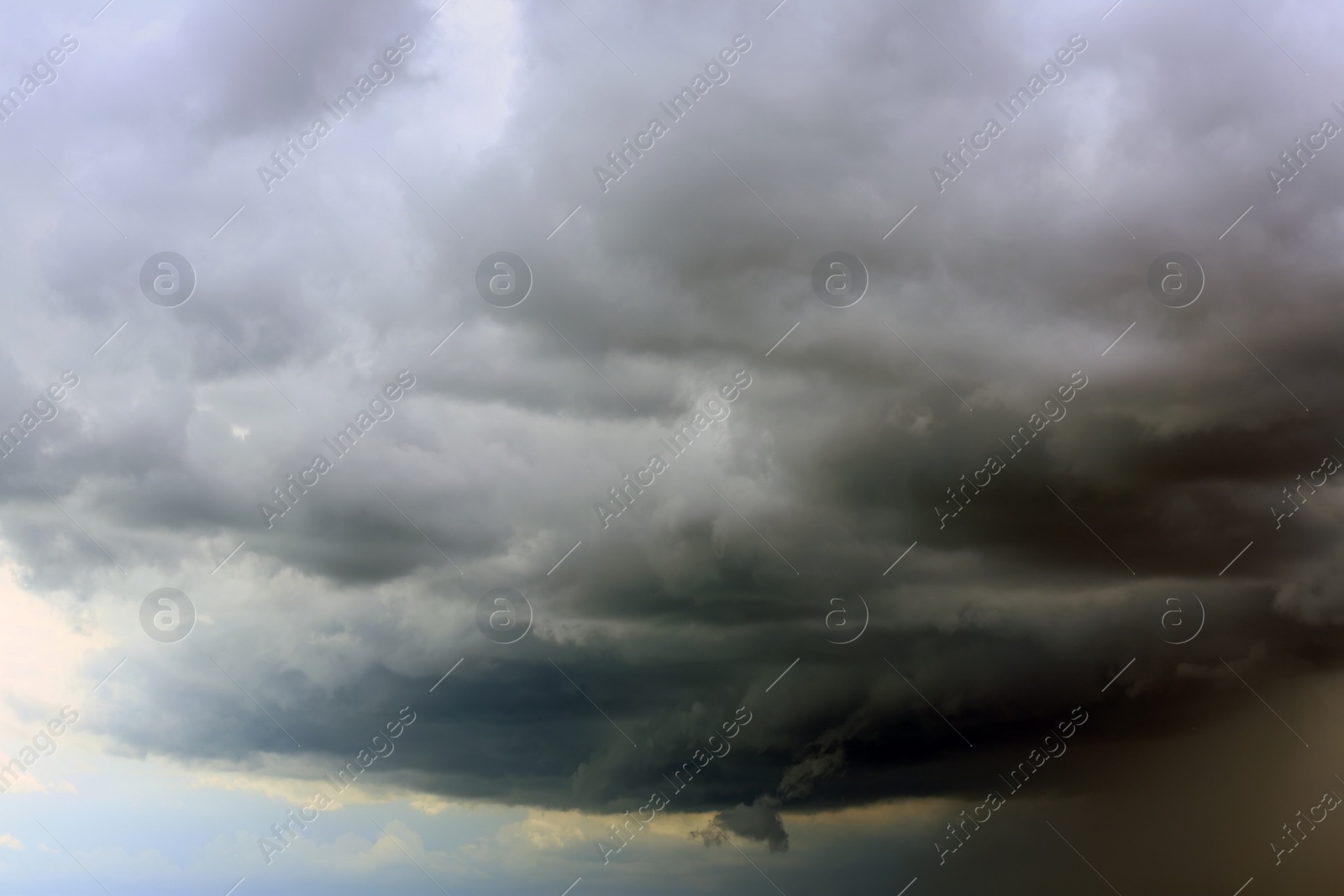 Photo of Sky with heavy rainy clouds on grey day