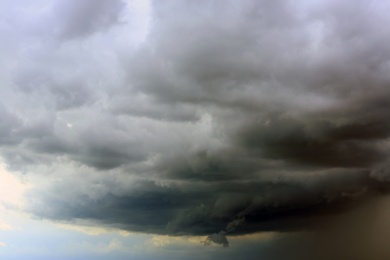 Sky with heavy rainy clouds on grey day