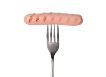 Photo of Fork with tasty cooked sausage on white background. Meat product