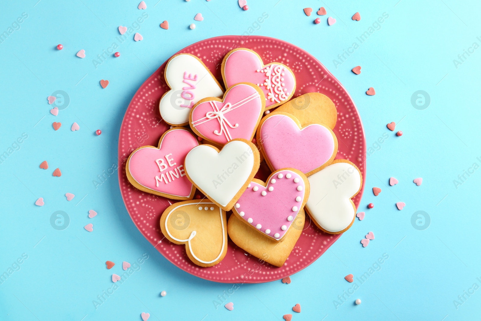 Photo of Composition with decorated heart shaped cookies on color background, top view