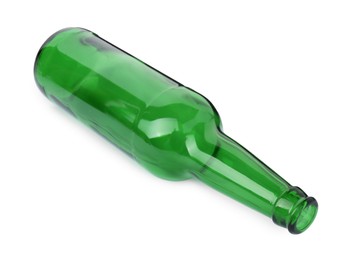 Photo of One empty green beer bottle isolated on white