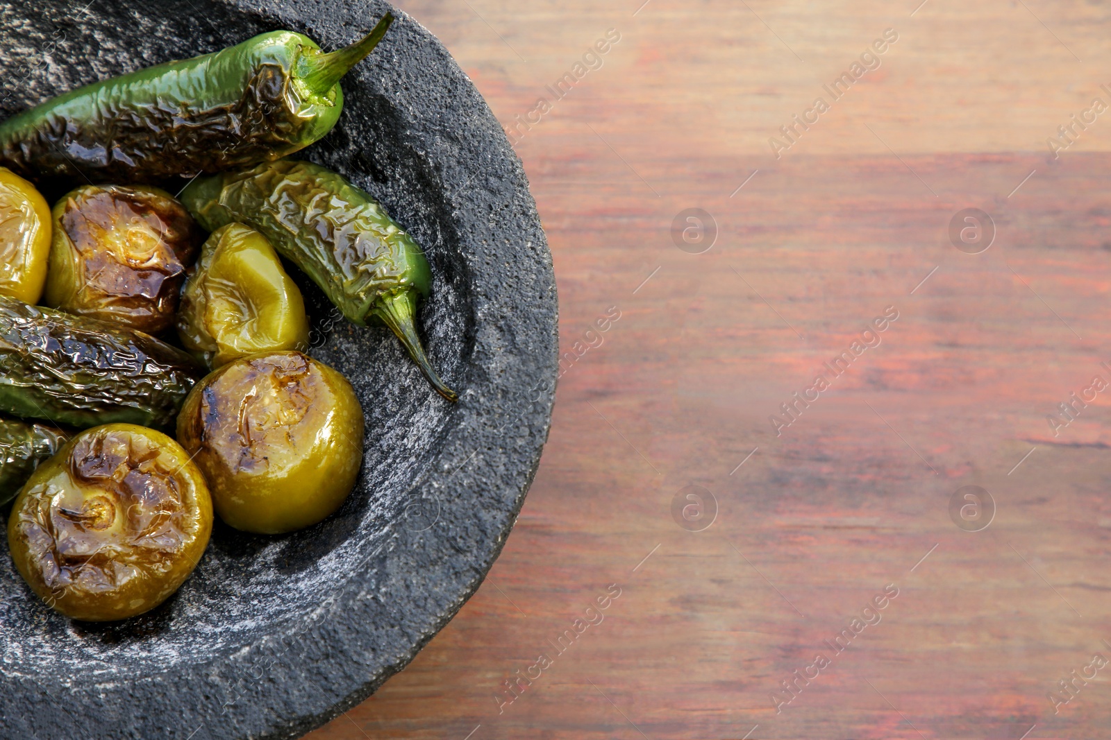 Photo of Different ingredients for cooking tasty salsa sauce on wooden table, top view. Space for text