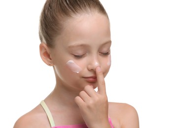 Photo of Happy girl applying sun protection cream onto her face isolated on white, closeup