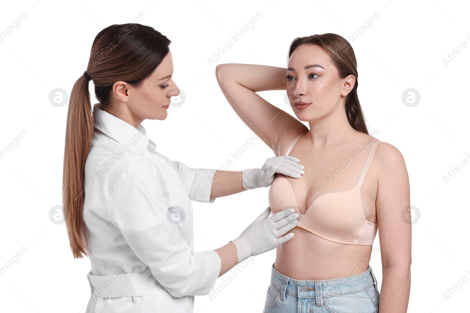 Photo of Mammologist checking woman's breast on white background