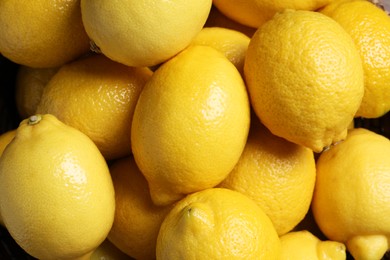 Photo of Many fresh lemons as background, top view