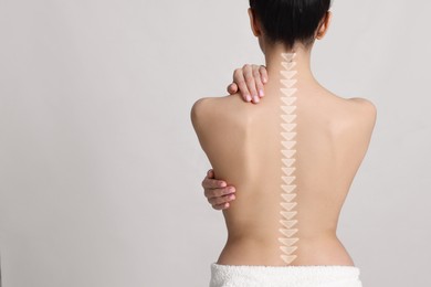 Image of Woman with healthy back on light background, space for text. Illustration of spine