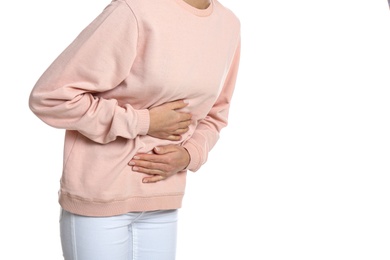 Photo of Woman suffering from stomach ache on white background, closeup. Food poisoning