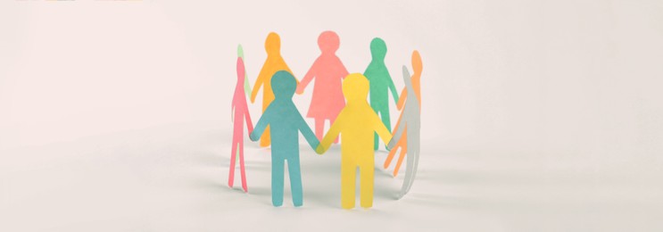 Image of Paper human figures making circle on white background, banner design. Diversity and Inclusion concept