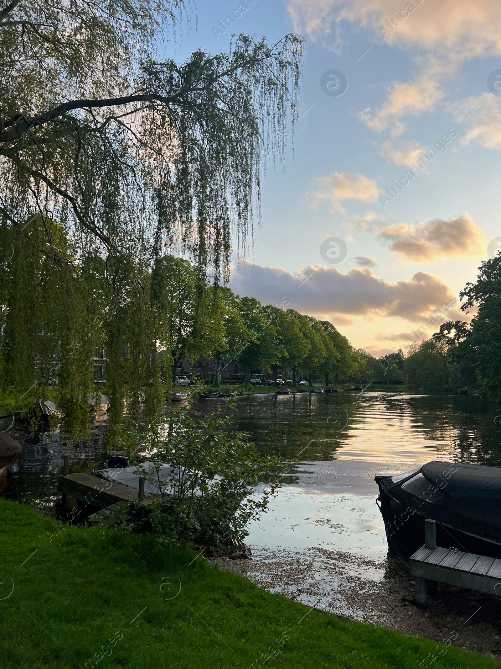 Photo of Beautiful view of canal with moored boats outdoors on spring day