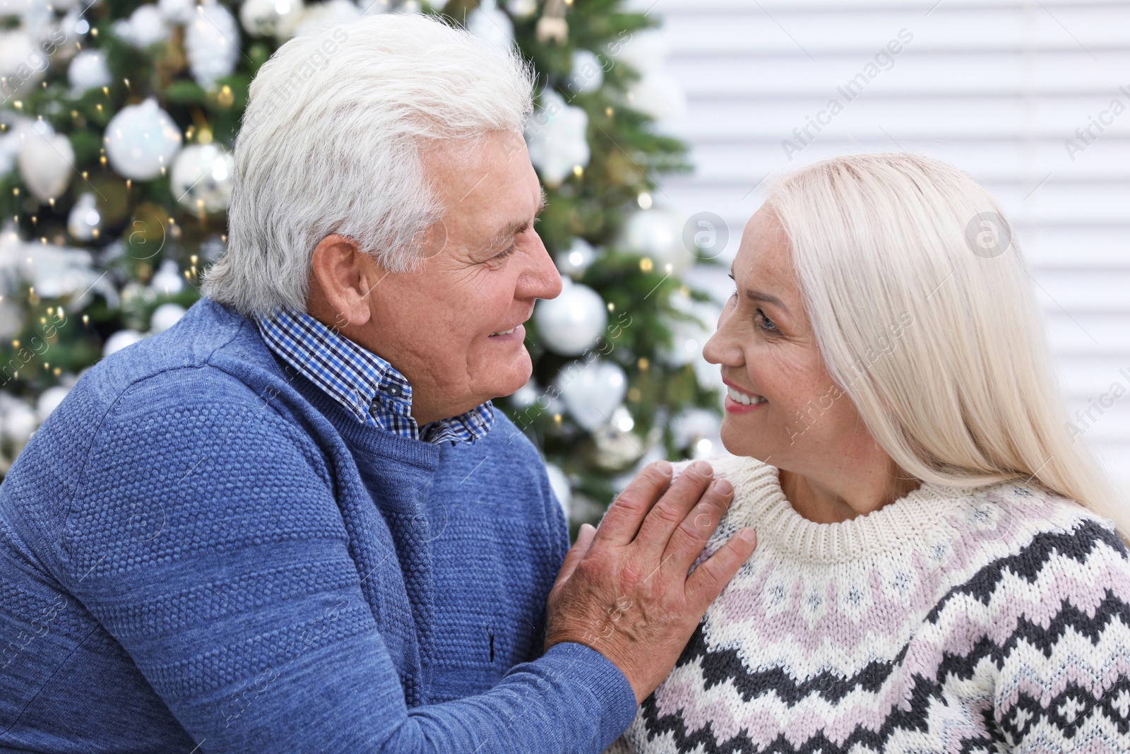 Photo of Happy mature couple at home. Christmas celebration