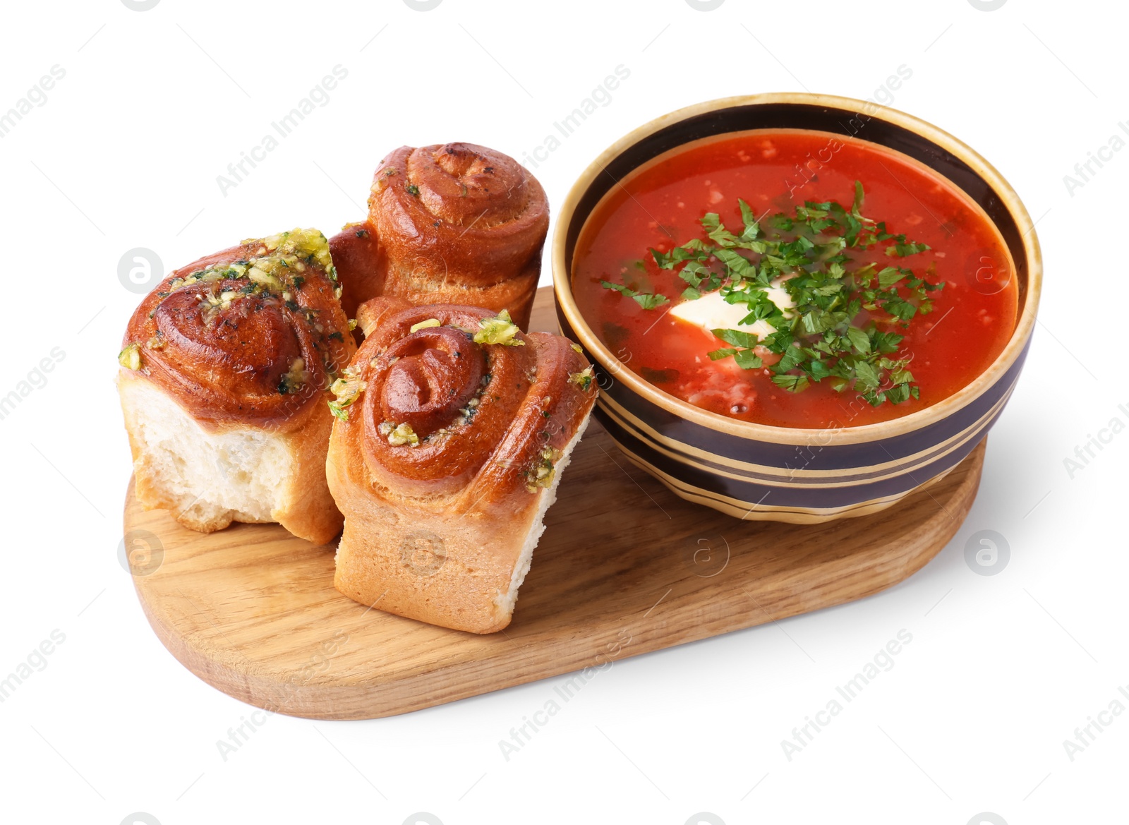 Photo of Tasty fresh pampushky and borsch. Traditional Ukrainian buns with garlic and beet soup isolated on white