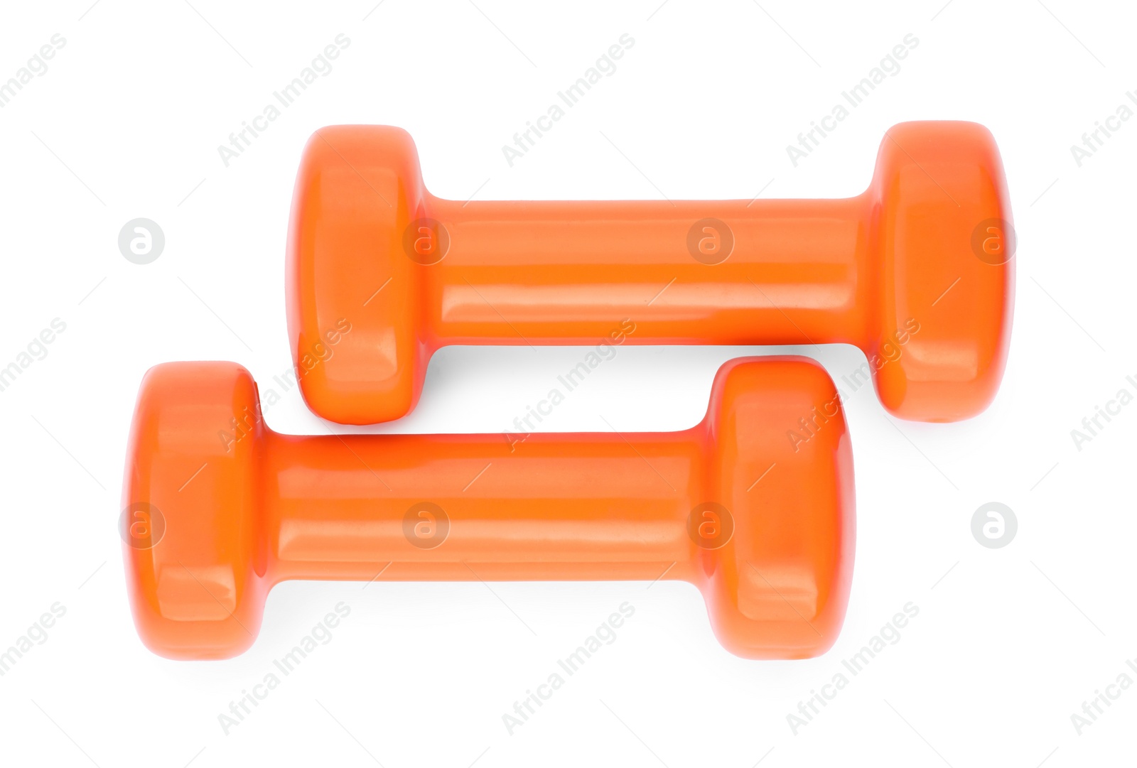 Photo of Orange dumbbells isolated on white, top view. Sports equipment