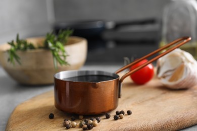 Photo of Organic balsamic vinegar and cooking ingredients on table