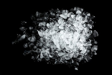 Photo of Heap of crushed ice on black table, top view