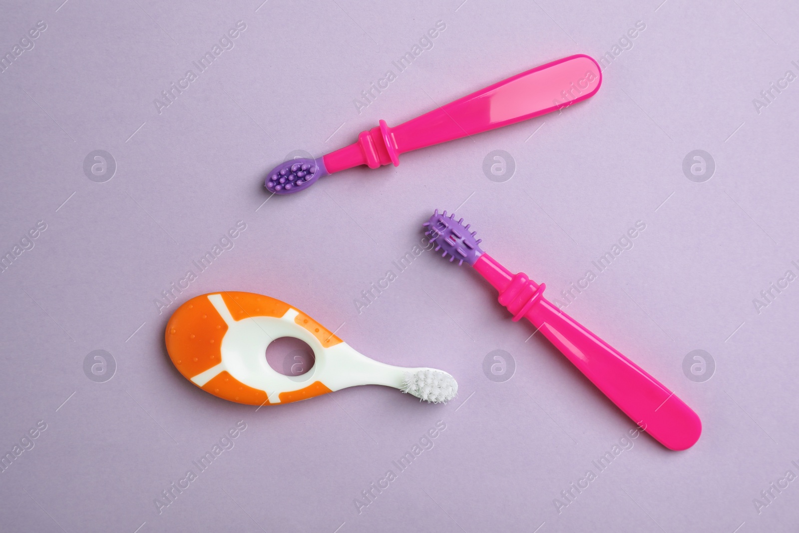 Photo of Manual toothbrushes for children on color background, top view