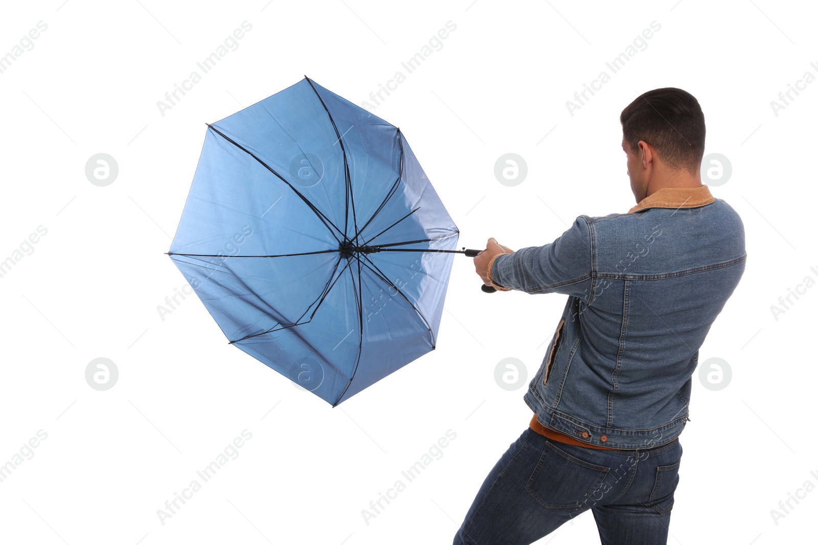 Photo of Man with umbrella caught in gust of wind on white background