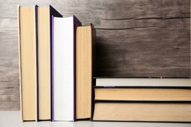 Photo of Collection of different books on white shelf