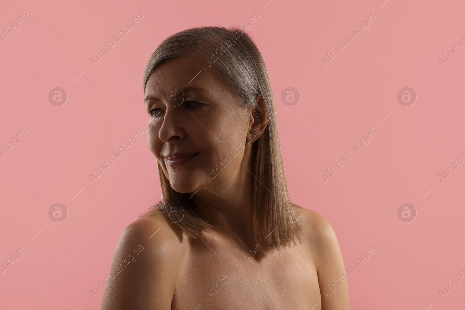 Photo of Beautiful woman with healthy skin on pink background