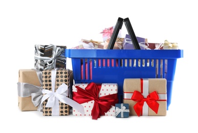 Photo of Blue shopping basket with different gifts on white background