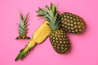 Photo of Fresh pineapples on color background