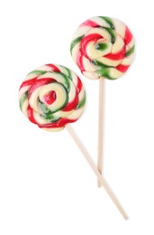 Photo of Colorful lollipops on white background, top view