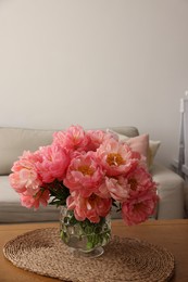 Photo of Beautiful pink peonies in vase on table at home, space for text. Interior design