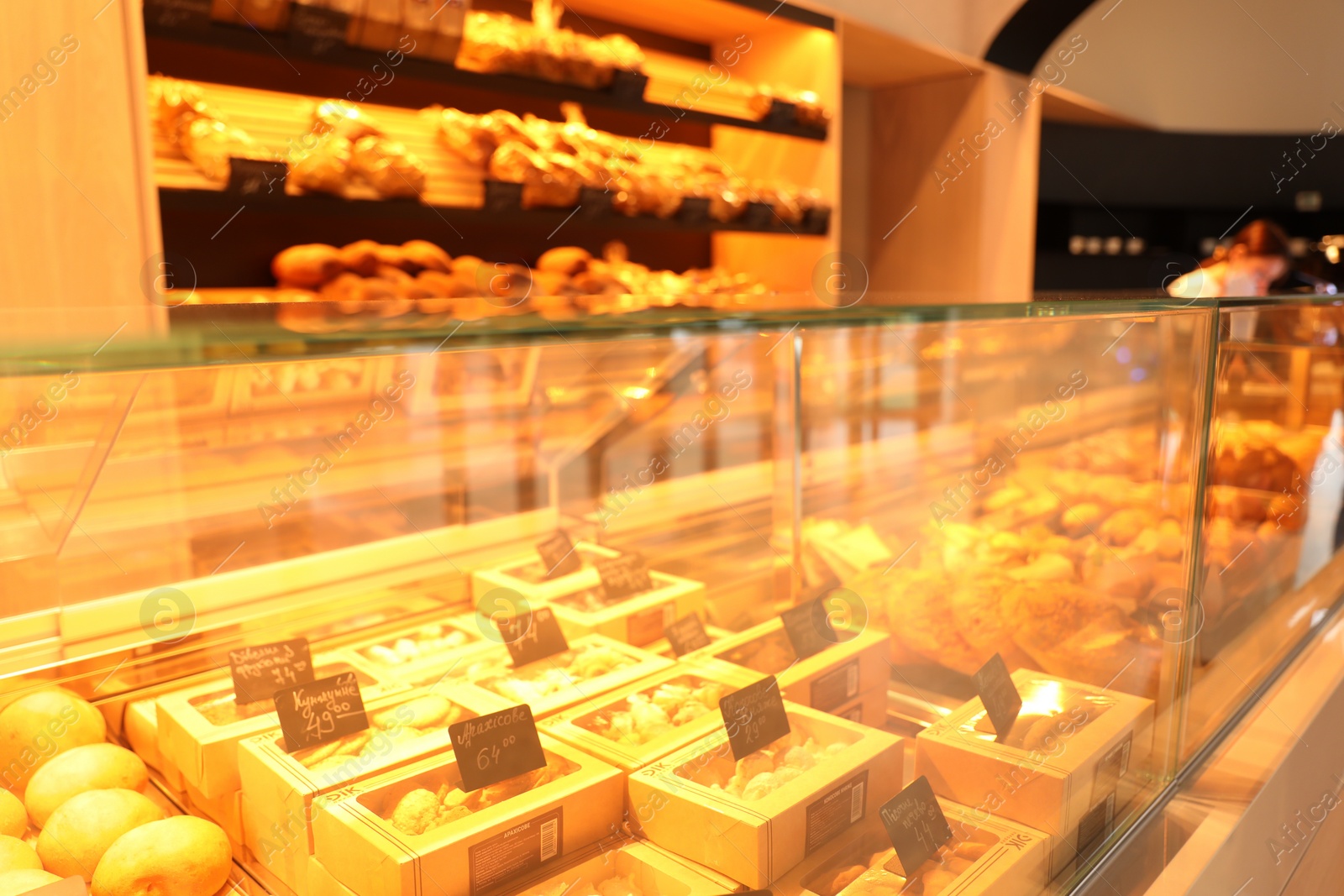 Photo of Fresh pastries on counter in bakery store