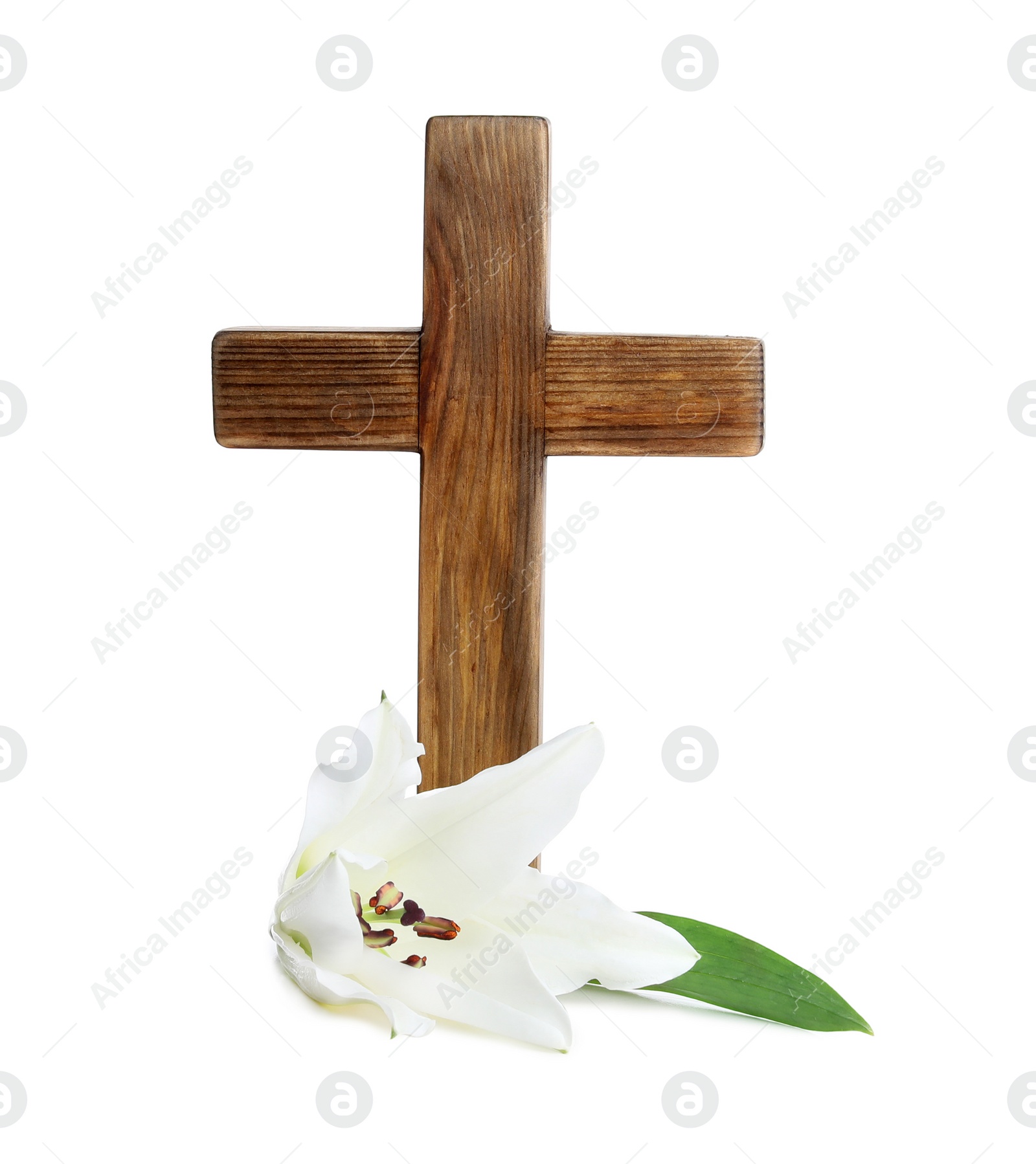 Photo of Wooden cross and blossom lily on white background