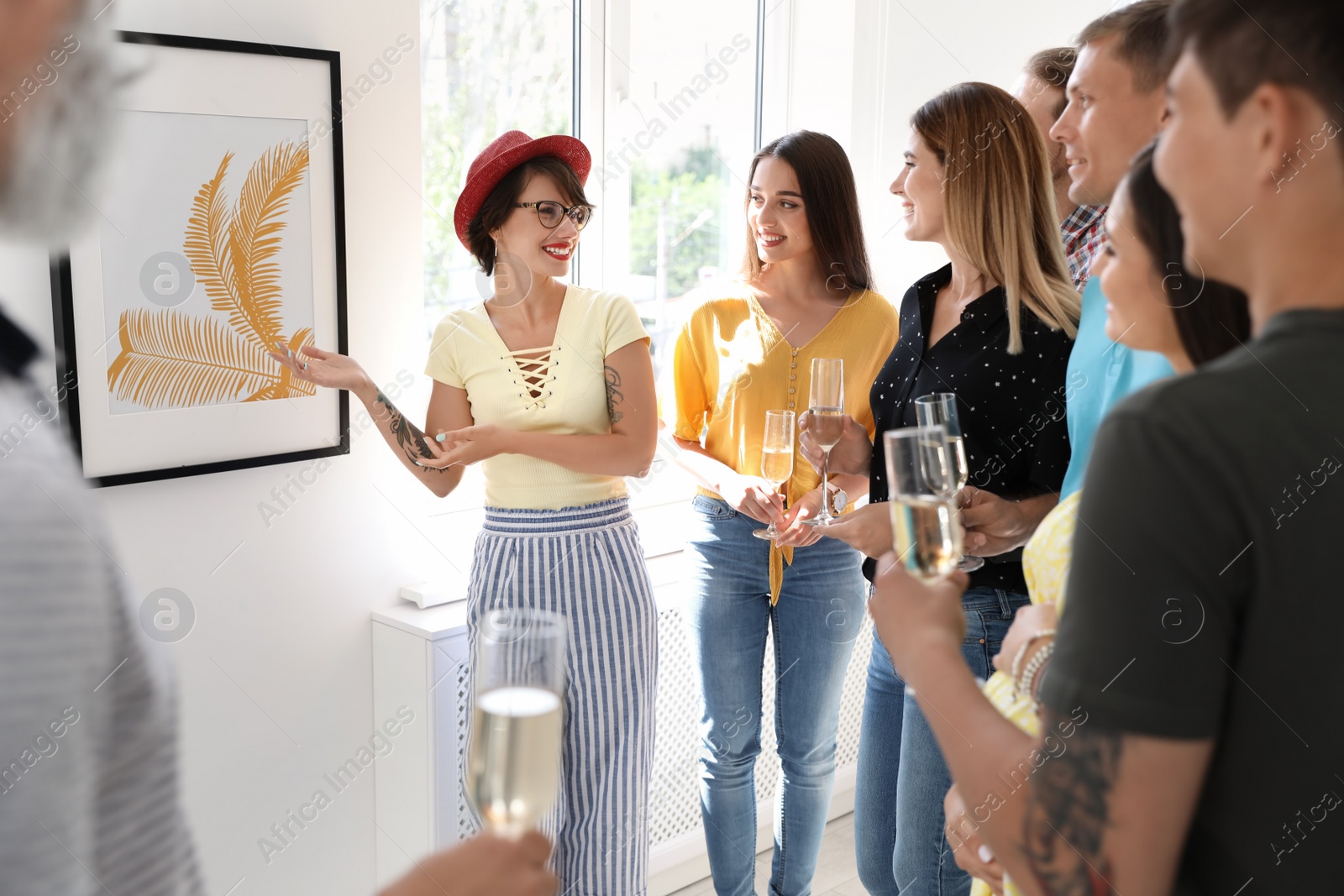 Photo of Group of people with guide at exhibition in art gallery