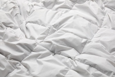 Photo of Soft crumpled blanket as background, closeup view