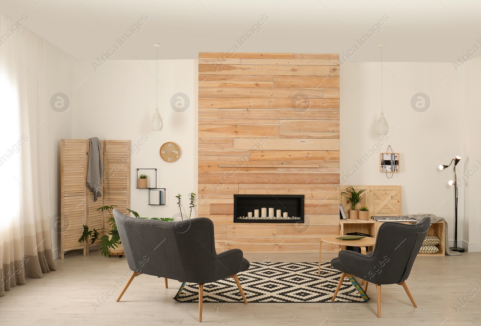 Photo of Living room interior with decorative fireplace in wooden wall