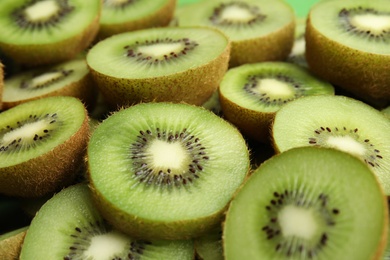 Halves of fresh kiwis as background, closeup