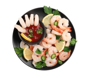 Photo of Tasty boiled shrimps with cocktail sauce, chili, parsley and lemon isolated on white, top view