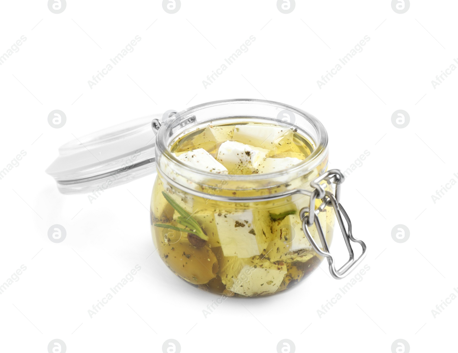 Photo of Open jar with feta cheese marinated in oil on white background. Pickled food