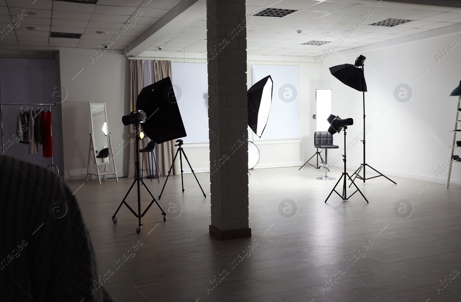 Photo of Interior of modern photo studio with professional equipment