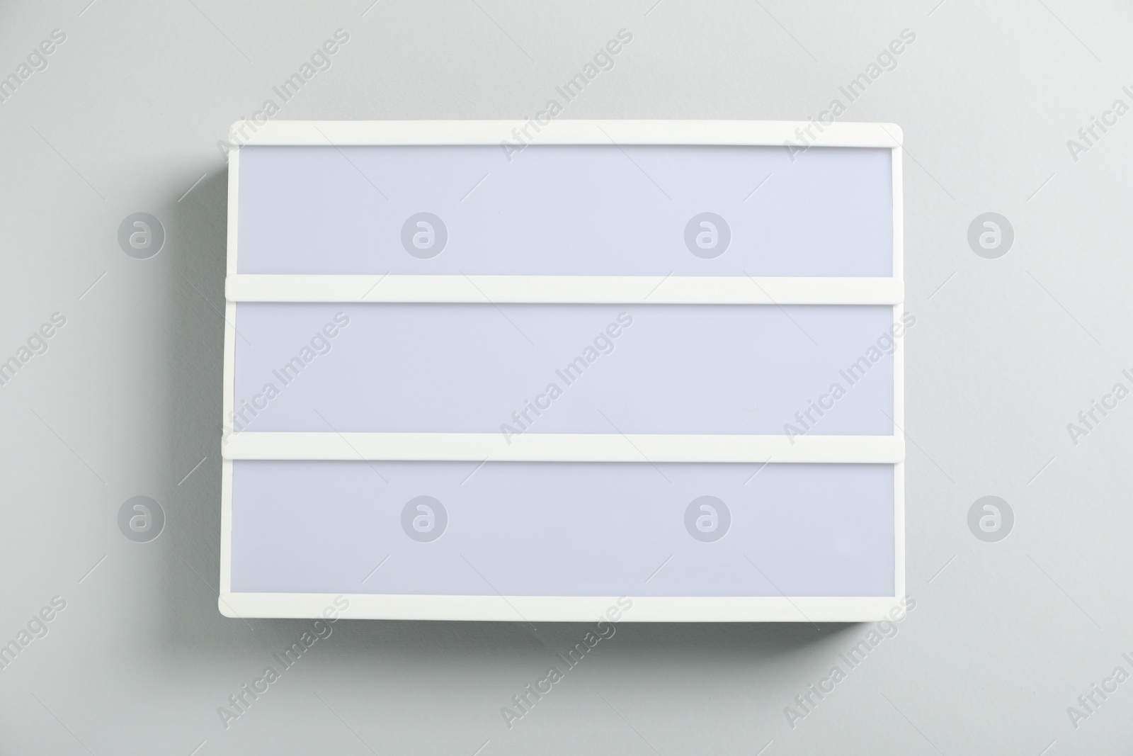 Photo of Blank letter board on white background, top view