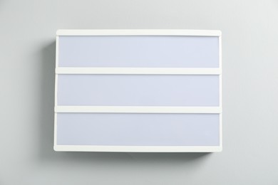 Photo of Blank letter board on white background, top view