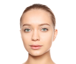 Portrait of young woman with foundation on her face against white background