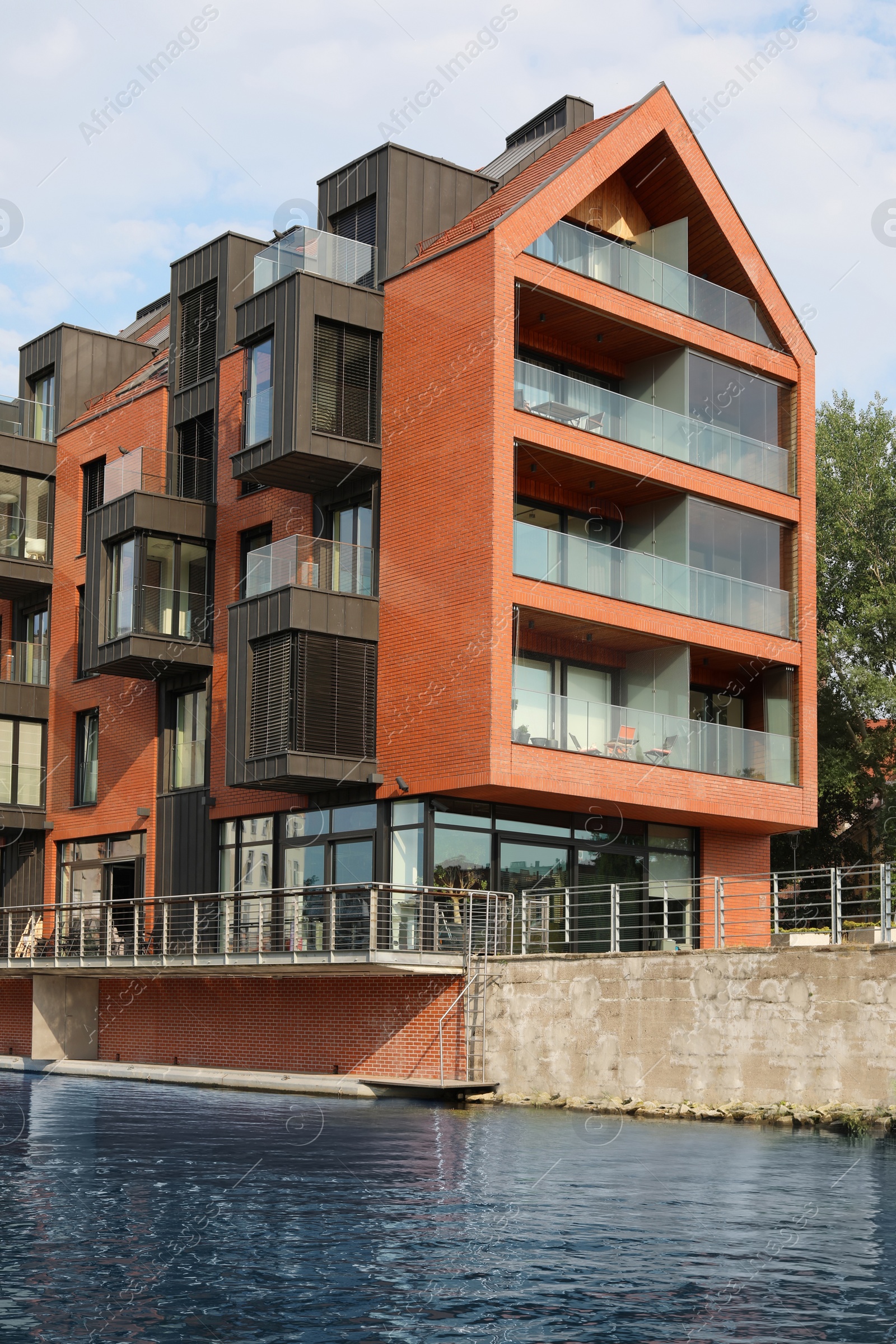 Photo of Beautiful view of brick building near river