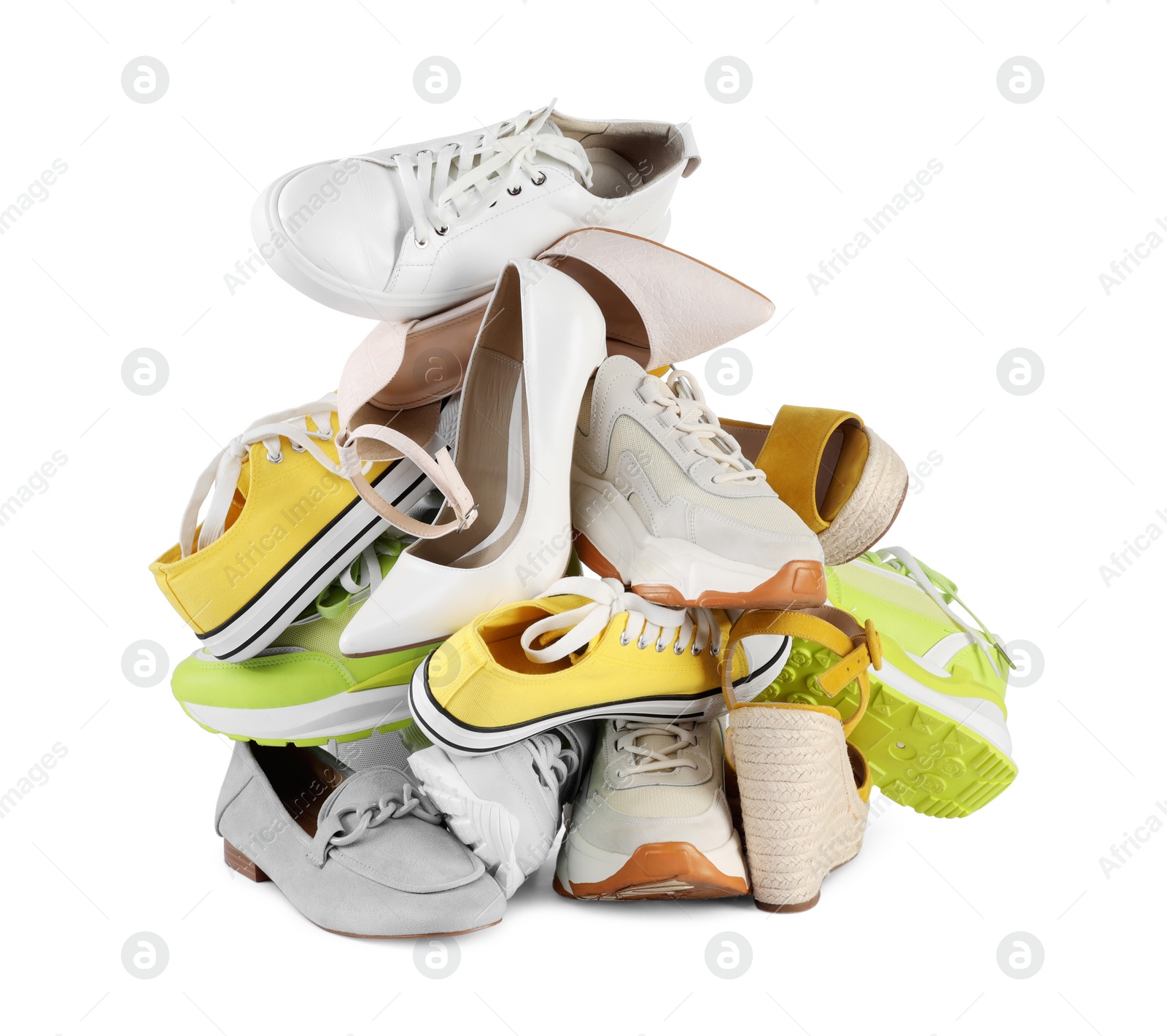 Photo of Pile of different female shoes isolated on white