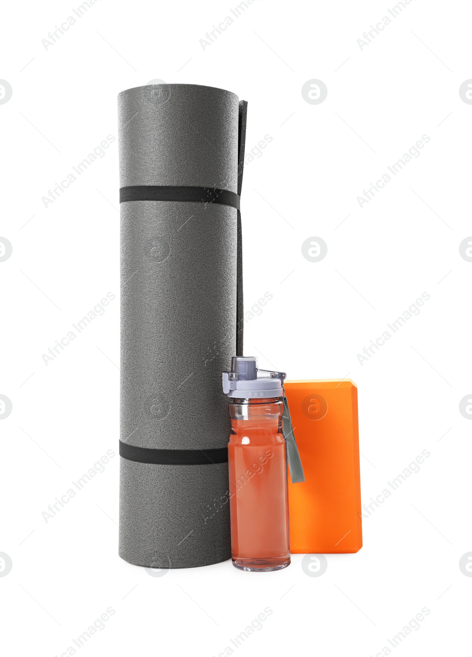 Photo of Grey exercise mat, yoga block and bottle of water isolated on white