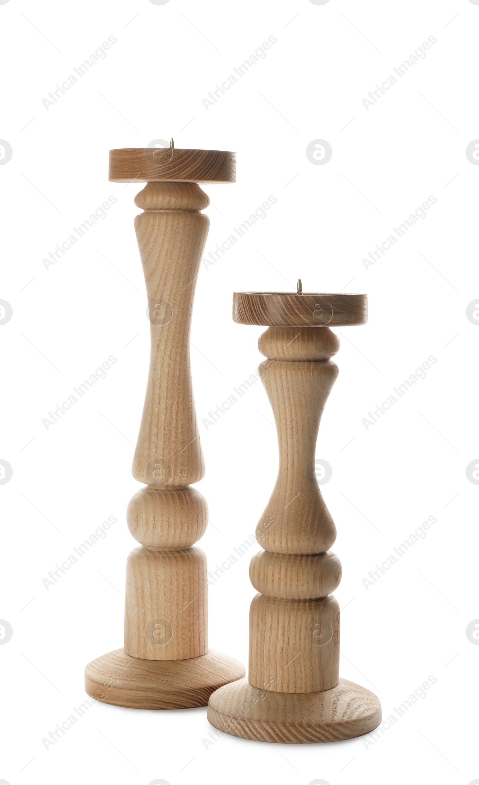 Photo of Two stylish wooden candlesticks on white background