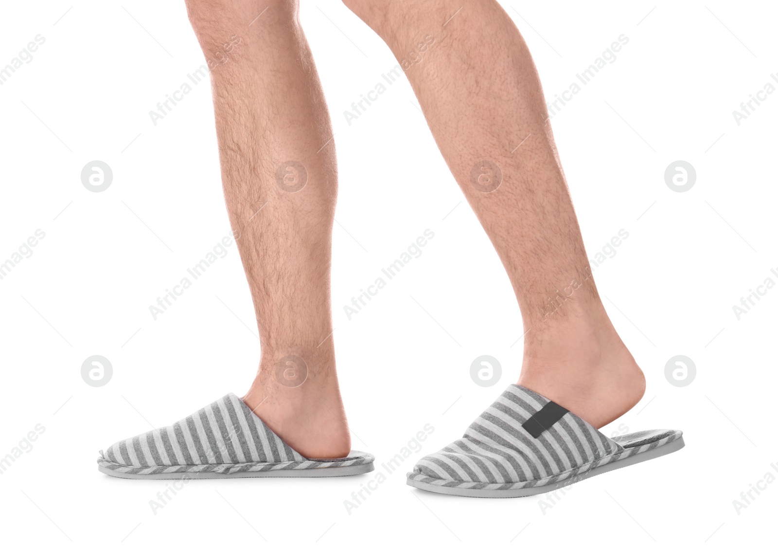 Photo of Man in warm soft slippers on white background, closeup