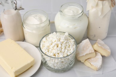 Different fresh dairy products on white table