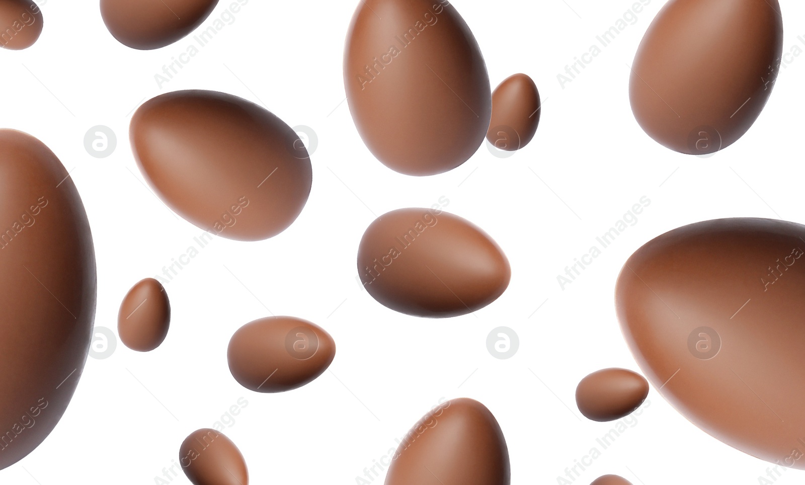 Image of Many chocolate eggs falling on white background