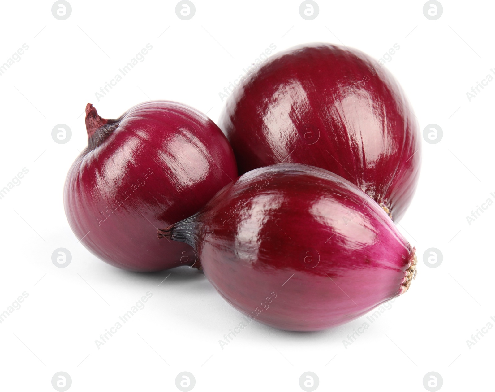 Photo of Fresh whole red onions on white background